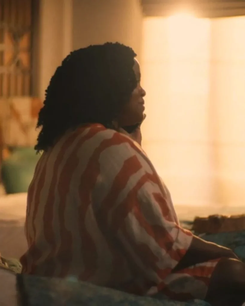 Belinda's orange and white striped dress