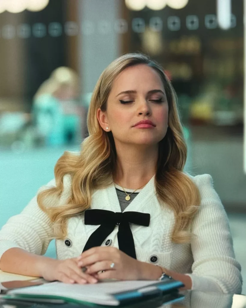 Ainsley's White Cardigan With Black Bow