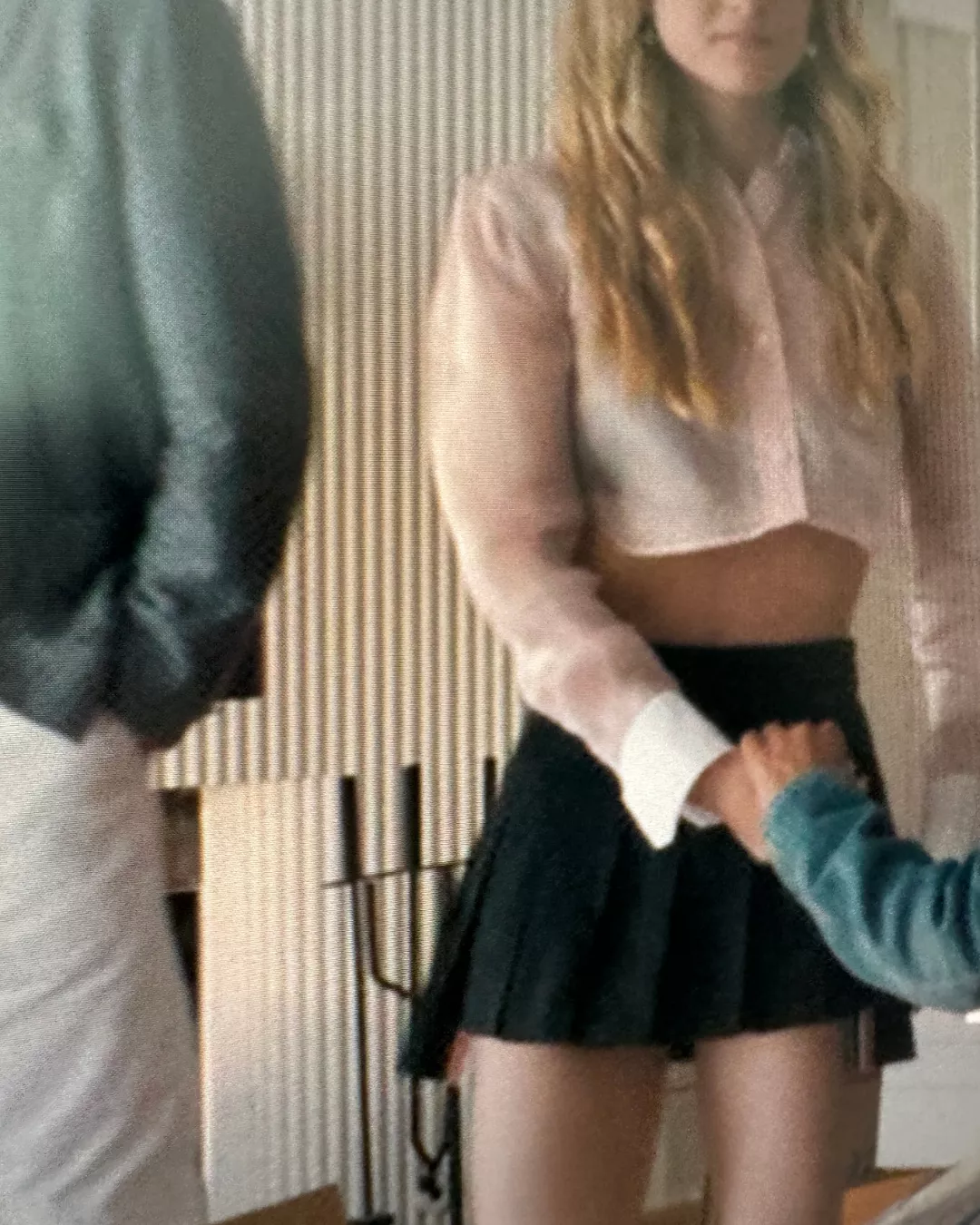 Cora's black pleated miniskirt