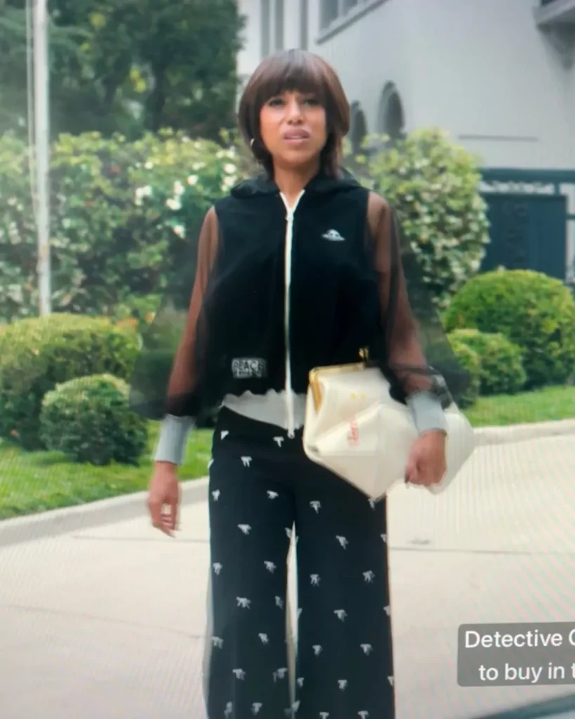 Eleanor's Black zip-up and Black Bow Pants