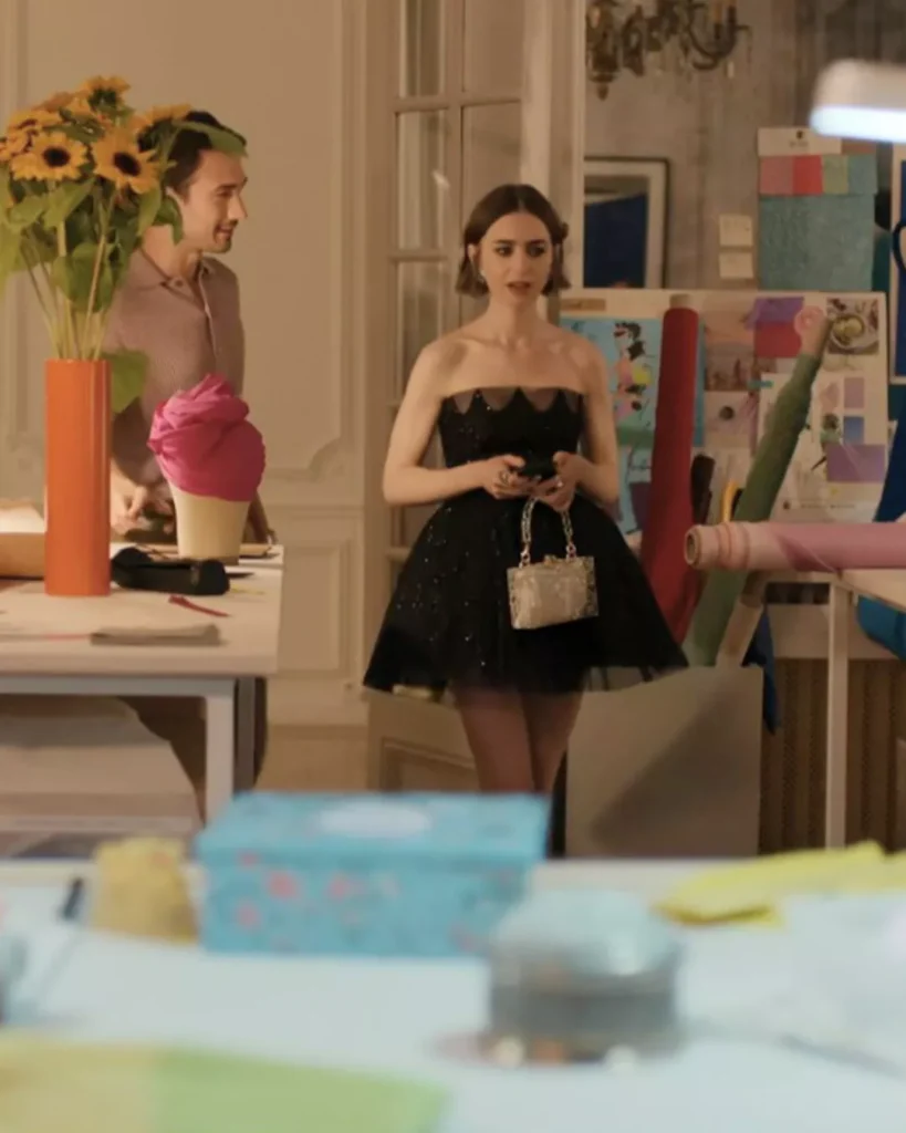 Emily’s black dress and embellished earrings