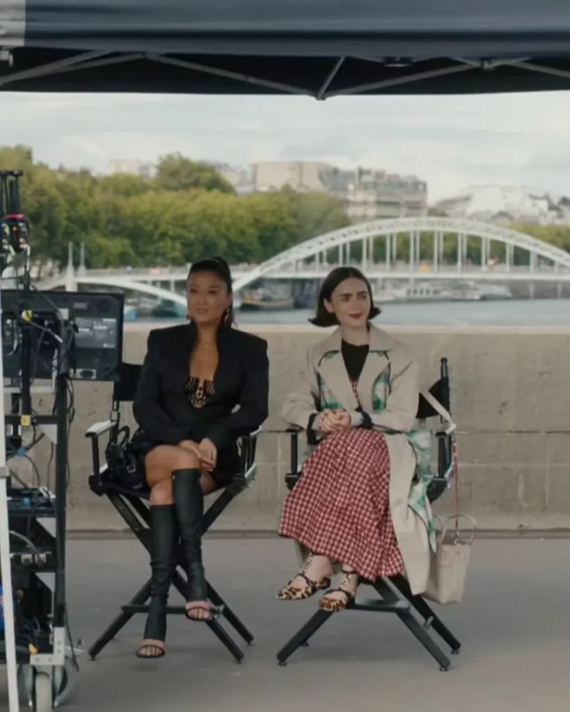Emily’s plaid trench coat and red gingham dress