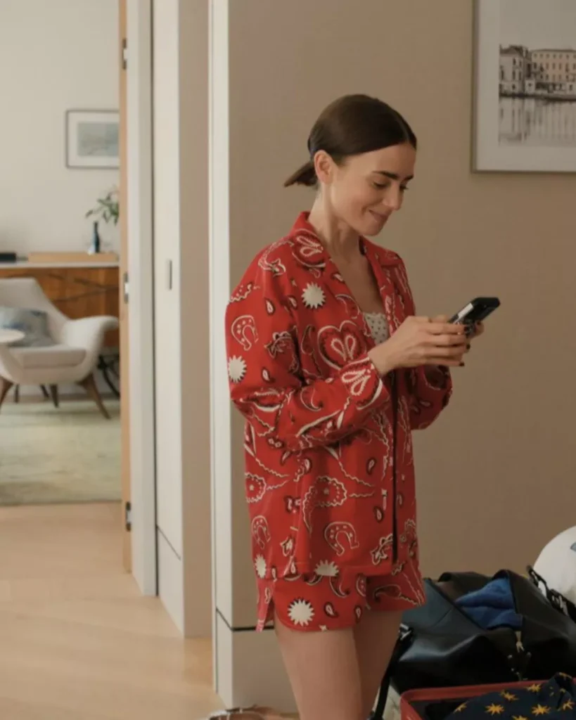 Emily’s red silk matching jacket and shorts