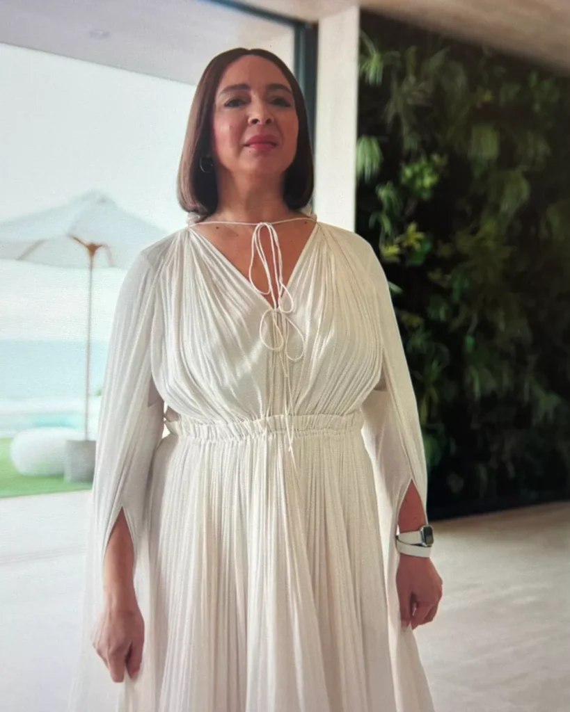 Molly's White Pleated Dress on Apple TV+ Loot Season 2 Episode 1