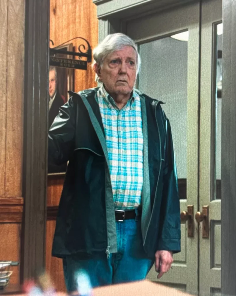 Navy Blue Rain Jacket on Widow's Bay S01E09