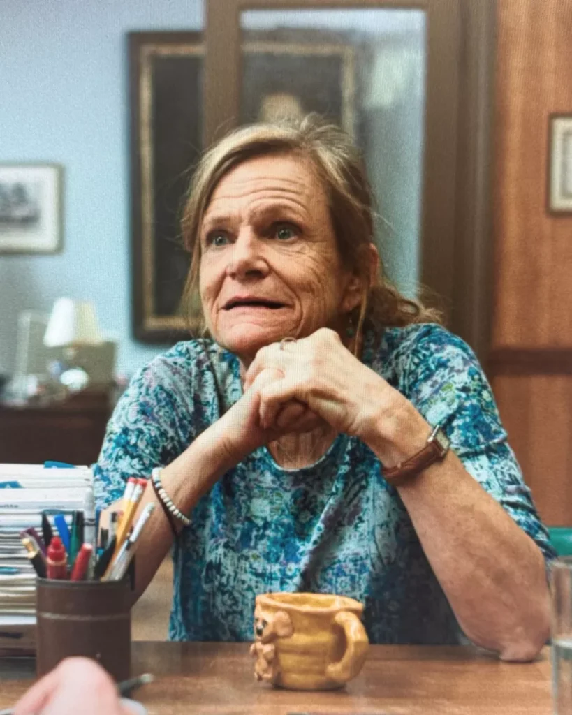 Rosemary's Blue Pattern Top on Widow's Bay S01E03