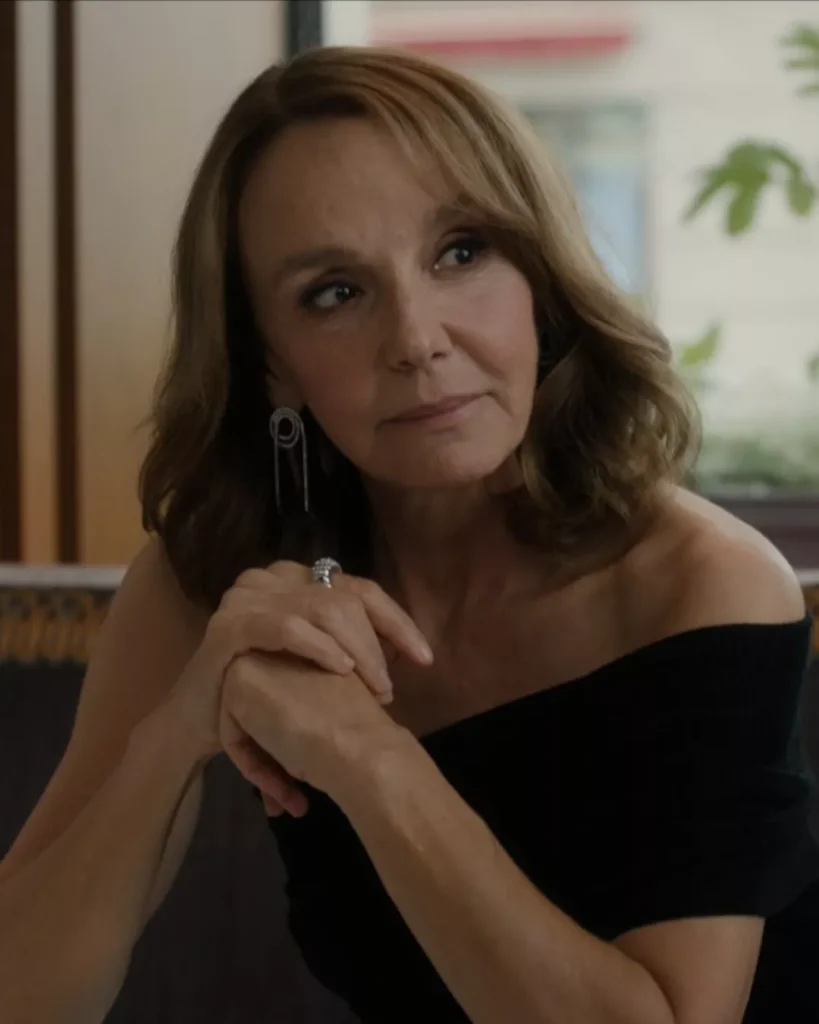 Sylvie’s Black One-Shoulder Dress and silver earrings