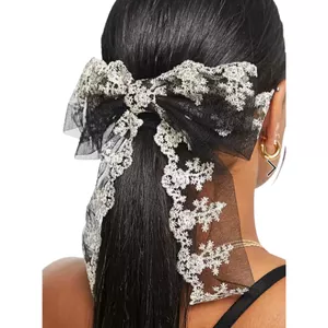 True Decadence bow hair clip in black with cream lace